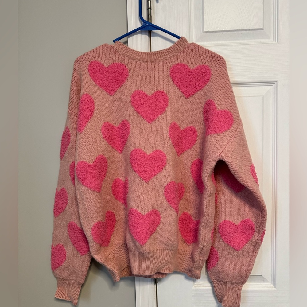 Attention all Pink loves!! Never Worn: Pink Fuzzy Heart Sweater. Size small.